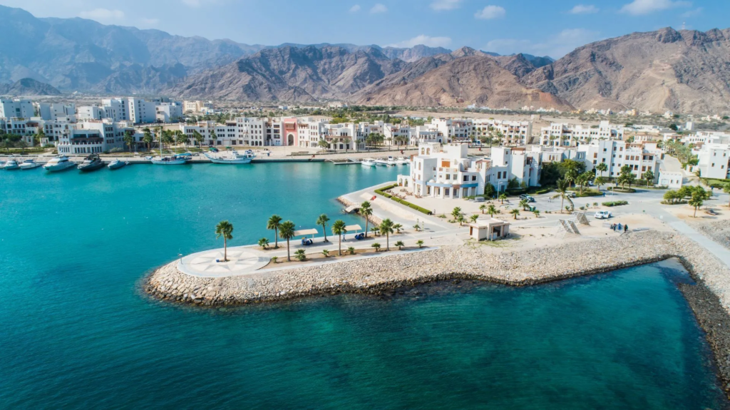 Jebel Sifah beach, marina and Hajar mountains from the air