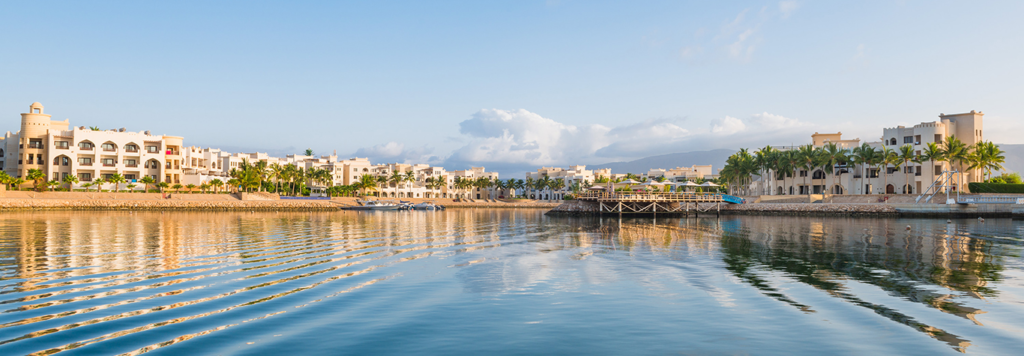 Juweira Boutique Hotel seen from the water at Hawana Salalah marina
