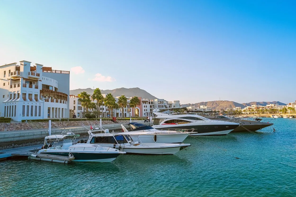 Yachts berthed in Jebel Sifah marina